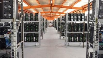 A photo of a large mining farm with many Iceriver miners operating.