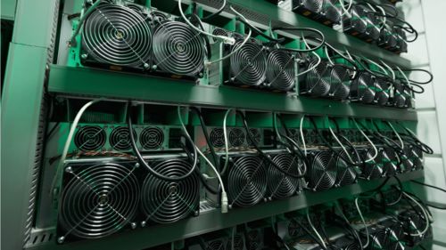 An aerial view of a bustling mining farm in Iceland, illustrating the seamless integration of geothermal energy for hosting advanced mining machines